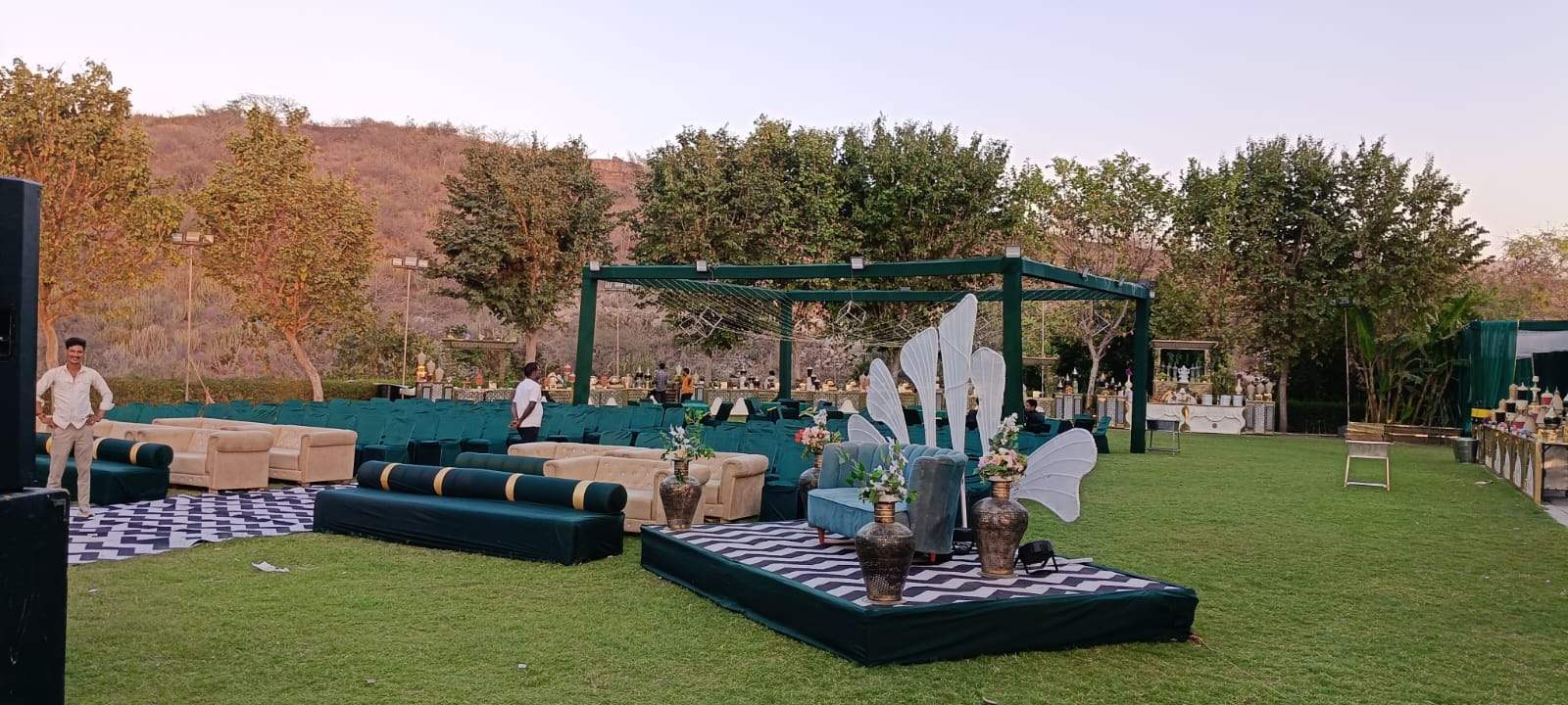 Emerald wedding lounge with floral pergolas
