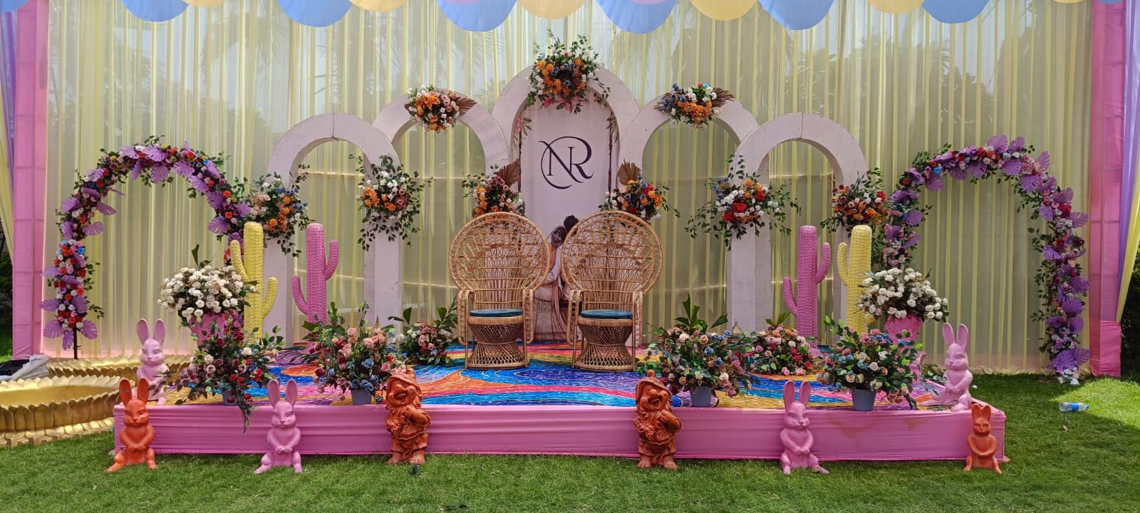 Evening lighting and decor setup at a wedding lawn